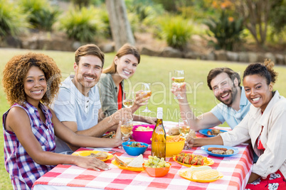 Friends having wine with breakfast