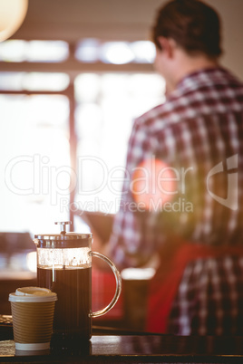 French press and cup of coffee