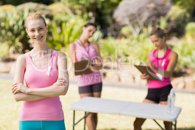 Female volunteer standing in park