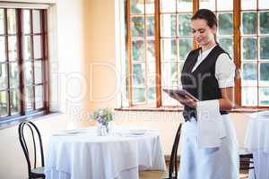 Waitress using a tablet