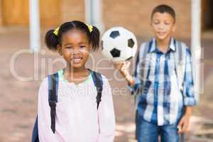 Smiling kids standing in  at school