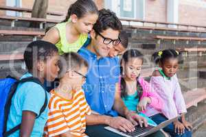 Teacher and kids using digital tablet