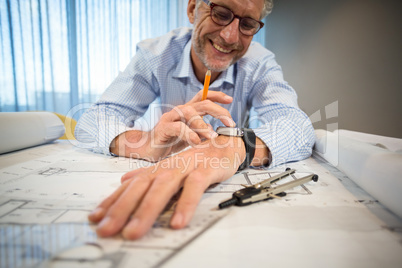 Man adjusting time on his watch