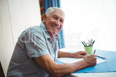Senior smiling man looking at the camera