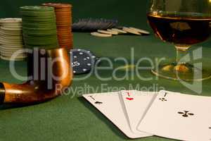 Poker concept with cards on green table