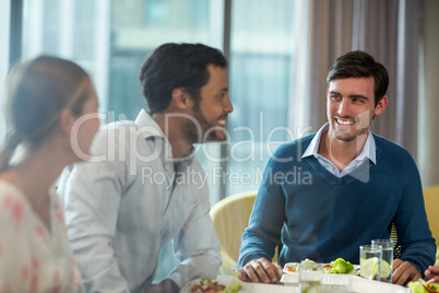 Business people having breakfast