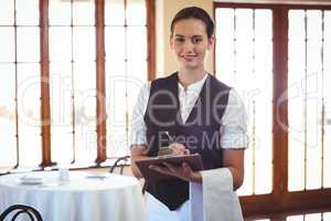 Waitress holding a clipboard