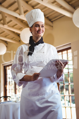 Chef holding a clipboard