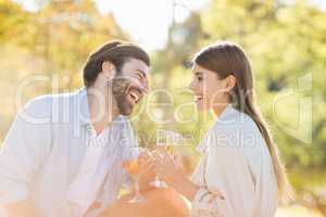 Couple holding glass of wine