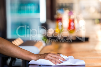 Waitress cleaning the counter