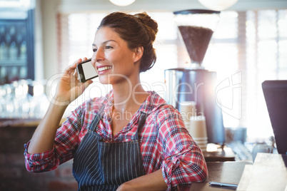 Waitress making a phone call