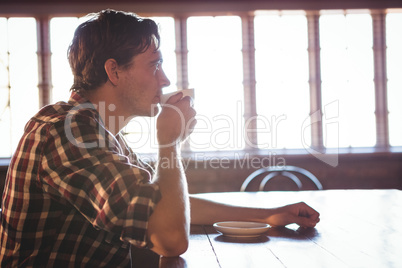 Man drinking a cup of coffee