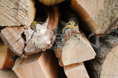 Natural wooden background - closeup of chopped firewood