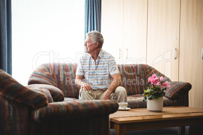 Senior man sitting on a couch