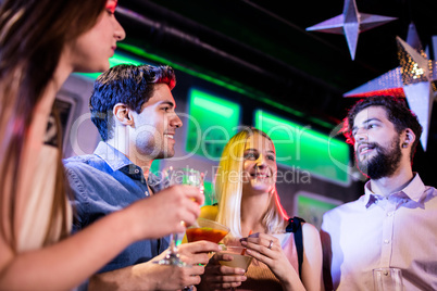 Group of friends having cocktail and wine