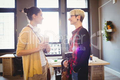 Graphic designers smiling while talking