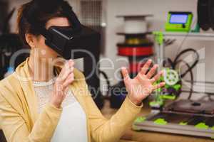 Female graphic designer using the virtual reality headset