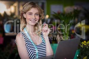 Female florist with the laptop