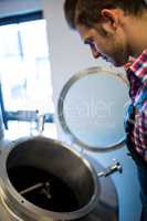 Maintenance worker working at brewery