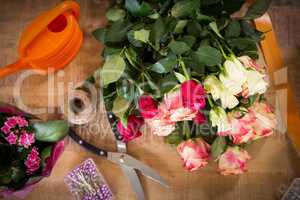 Bouquet of flower material on a wooden worktop