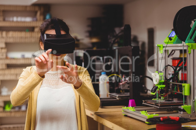 Female graphic designer using the virtual reality headset