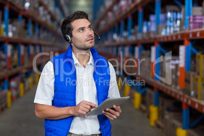 Worker touching a digital tablet