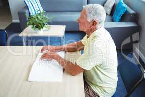 Senior man using braille to read