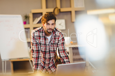 Portrait of graphic designer working on computer