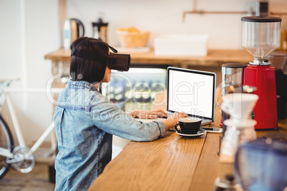 Young woman using the virtual reality headset