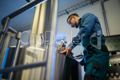 Maintenance worker working at brewery