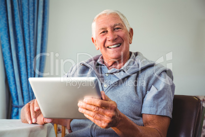 Senior man using a digital tablet