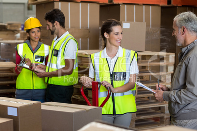 Focus of worker is laughing with her manager