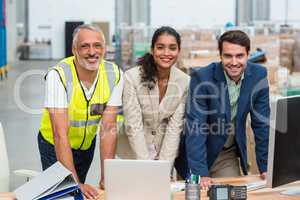 Portrait of worker team is posing and smiling during work