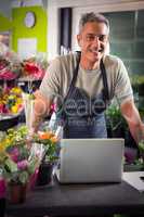 Portrait of happy male florist