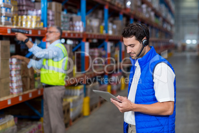 Worker looking at digital tablet