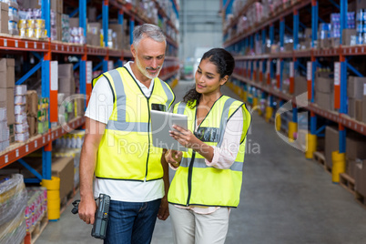 Portrait of workers are standing and looking a tablet