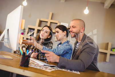 Team of graphic designer working on computer