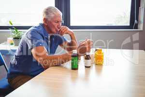Senior man holding medicine
