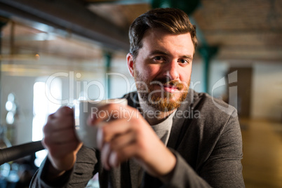 Man holding coffee cup