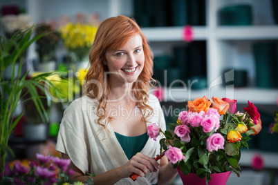 Female florist preparing flower bouquet