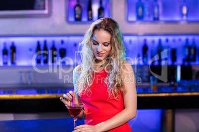Beautiful woman holding cocktail glass