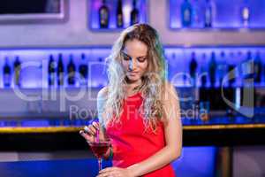 Beautiful woman holding cocktail glass