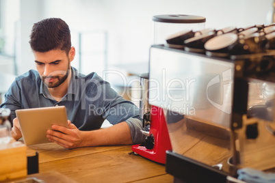 Young man using digital tablet