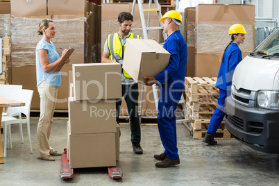 Workers carrying boxes