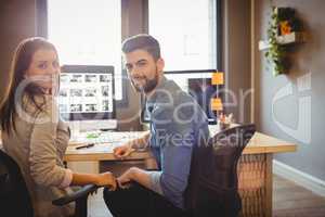 Graphic designers working at desk in the office