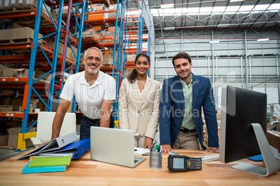 Low angle view of worker team is posing and smiling during work