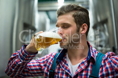 Brewer testing beer