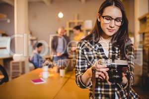 Graphic designer checking pictures in camera