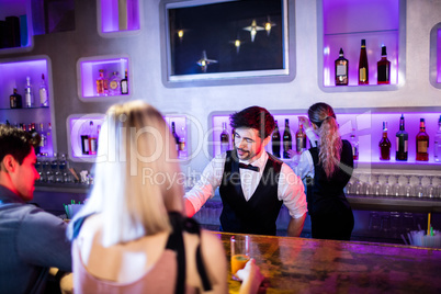 Waiter serving cocktail