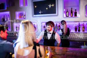 Waiter serving cocktail